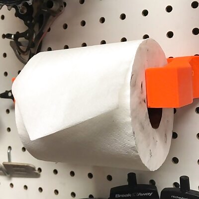 Pegboard holder for toilet paper roll