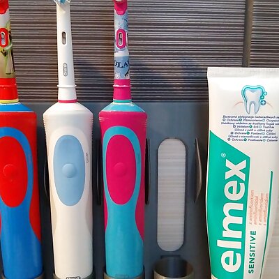 Family wall mount holder electric toothbrush OralB and toothpaste