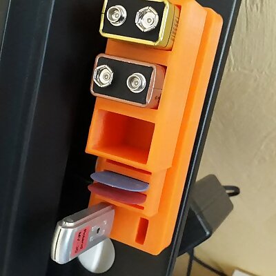 Guitar battery and picks and USB stick holder