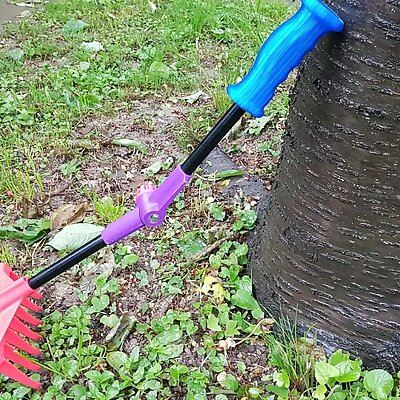 Garden rake with adjustable handle and ergonomic grip