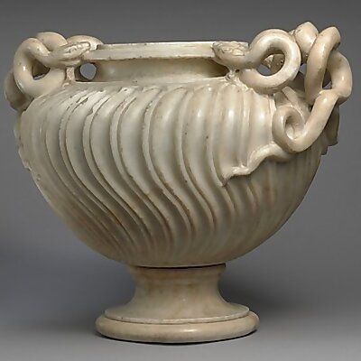 Marble strigilated vase with snake handle