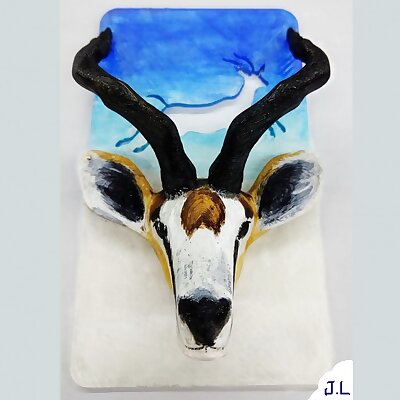 Phone standTibetan Antelope head supported by Meili snow mountain shape base