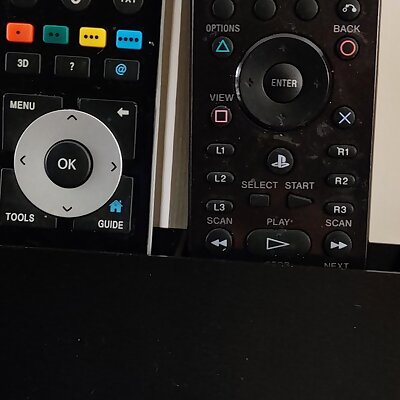 Wall mounted box for remotes