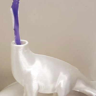 Dinosaur toothbrush holder merged