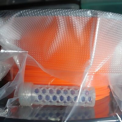 Desiccant container for vacuum seal bags