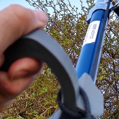 Device to hold and snip a long handled pruner