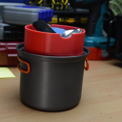 Gas bottle cover and utensil holder for backpacking stove