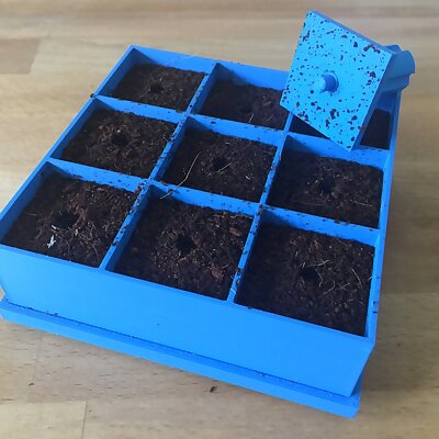 Seed germination tray with removable base and stamp