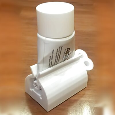 Toothpaste squeeze holder