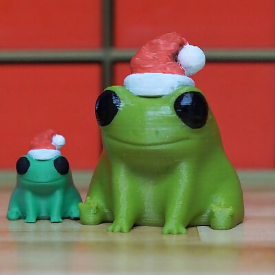 Fred the Frog but hes wearing a Santa Hat