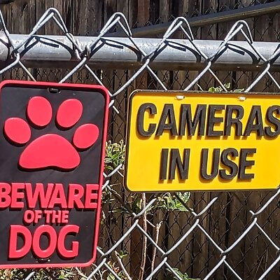CAMERAS IN USE sign