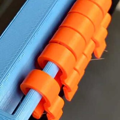 Rail for storing spare filament clips