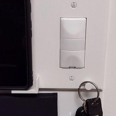 Wall switchoutlet plate that also holds your phone