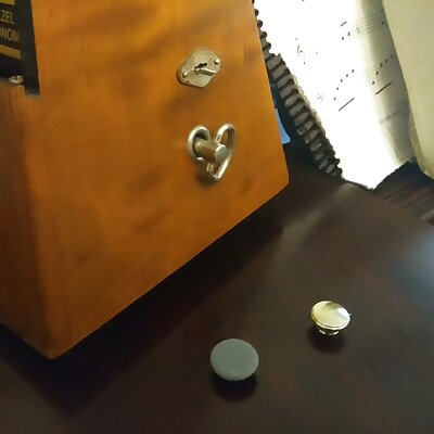 Metronome timing bell knob