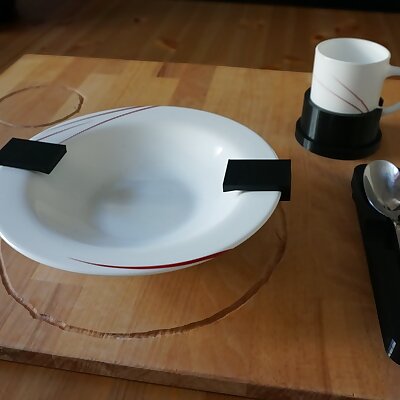 It holds your tableware in place  daily living aid for the visually impaired