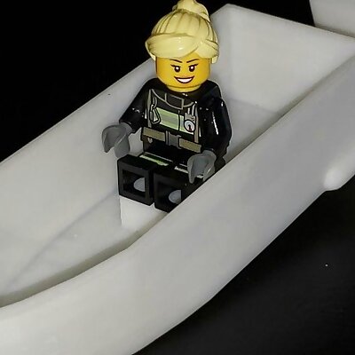 Rubberband powered paddle boat with Lego seat