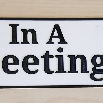 In A Meeting sign for door  with holes for magnets