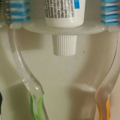Toothbrush holder for shower with extra slots