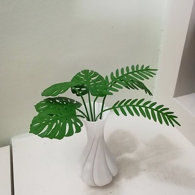 Twisted Vase with mimosa and monstera leaves