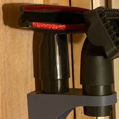 Wall bracket for vacuum attachments