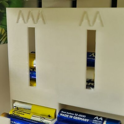 Battery holder for IKEA Skadis pegboard