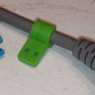Cable clip with screw or nail fixing tab