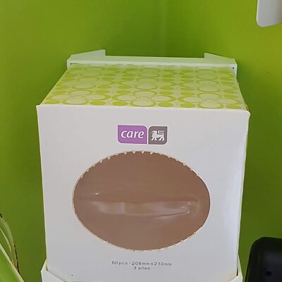 Corner mounted tissue box holder
