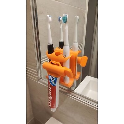 Toothpaste squeezer and toothbrush holder