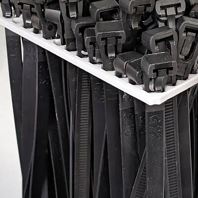 Wall mounted zip tie organizer