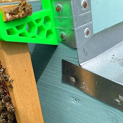 Bee hive frame holder
