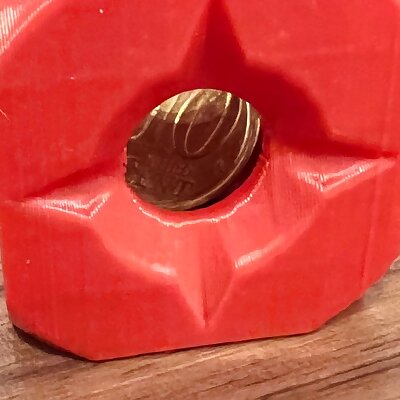 A coin stuck in a cube