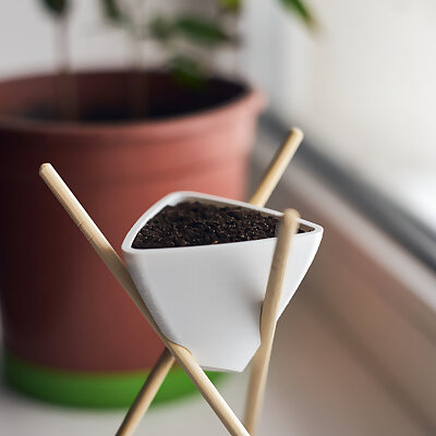 Triangular planter on chopsticks