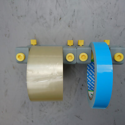 Adjustable tape rolls holder