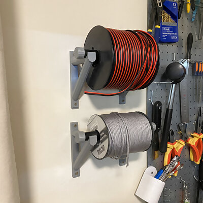 Wall mounted spool holder