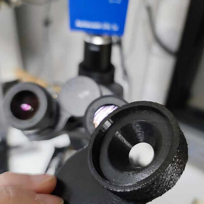 Spacer for microscope eyepiece and mobile phone