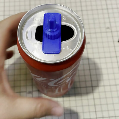 Electric drill accessory fix the top part of a soda can