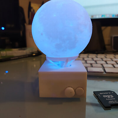 Illuminated rotating sphere stand