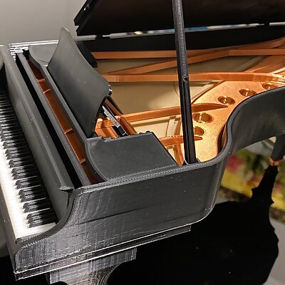 Grand piano with moving parts