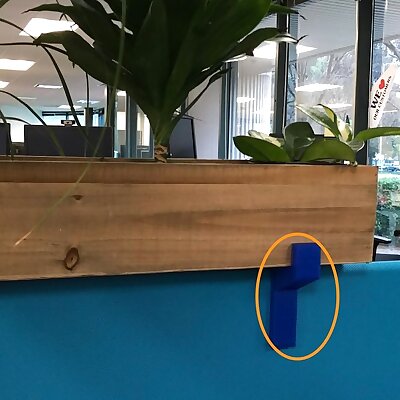 Planter Bracket attach a planter atop a cubicle partition